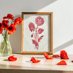 Framed botanical artwork of red poppies next to a vase of wild poppies. Sam Luck 8 x 10 inch linocut print wall art, UK.