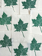 Print edition of a maple leaf linocut print, hand carved and printed in the UK.
