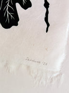 Close up of Sam Luck signature on a botanical linocut print.