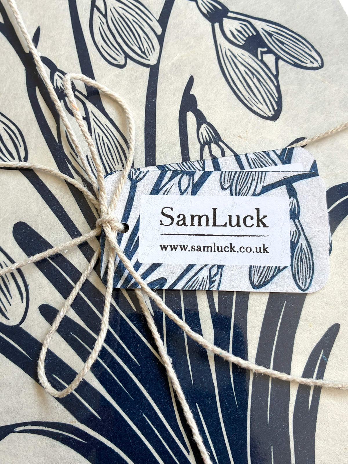 Close up of the gift tags I attach for my handmade linocut prints, ready to give as a thoughtful present.