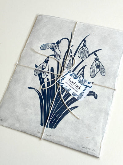 Gift wrapped linocut print packaged with string and a gift tag by Sam Luck UK.